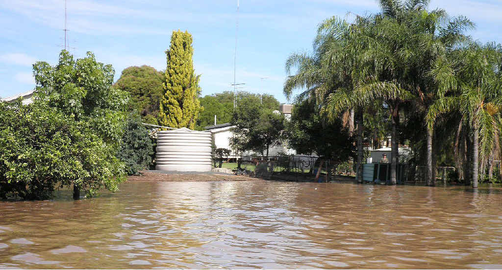 The Nandowrie homestead is made an island as floodwaters isolate the family home. The Nandowrie homestead is made an island as floodwaters isolate the family home.